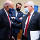 Postmaster General Louis DeJoy exchanges words with Rep. James Comer, the House Oversight Committee’s top Republican, during Monday’s hearing.